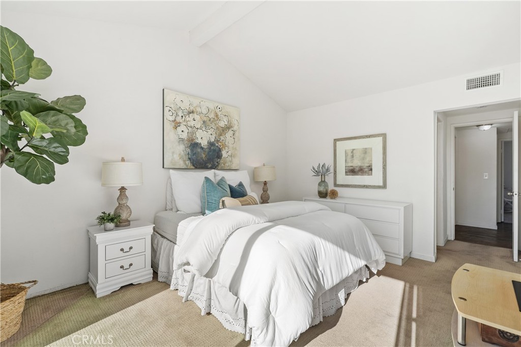 1041 Tustin Pines Way Tustin, CA 92780 - Photo 23 of 32 a bedroom with a bed and a couch