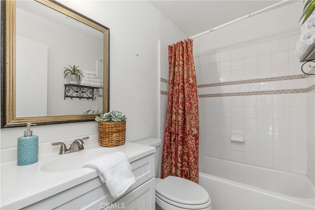 1041 Tustin Pines Way Tustin, CA 92780 - Photo 30 of 32 a bathroom with a sink toilet and shower