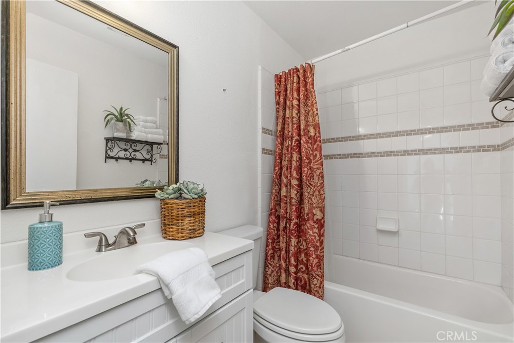 1041 Tustin Pines Way Tustin, CA 92780 - Photo 30 of 32 a bathroom with a sink toilet and shower
