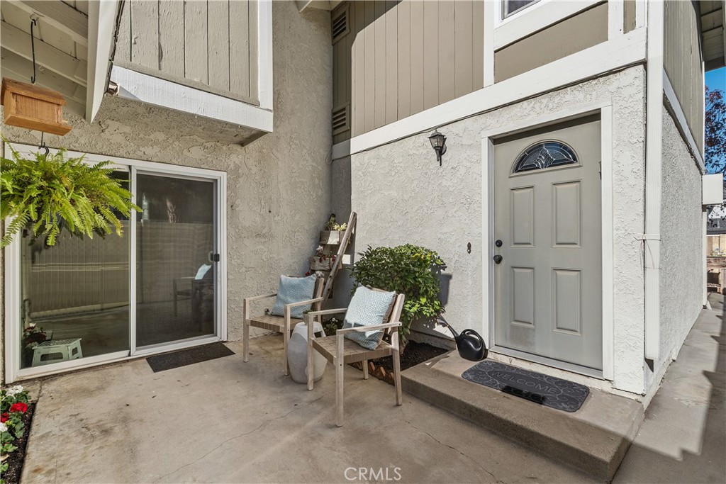 1041 Tustin Pines Way Tustin, CA 92780 - Photo 3 of 32 a backyard of a house with table and chairs