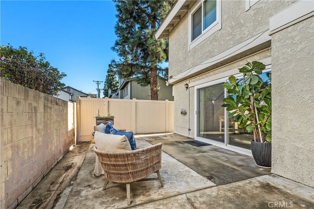 1041 Tustin Pines Way Tustin, CA 92780 - Photo 32 of 32 a backyard of a house with yard and outdoor seating