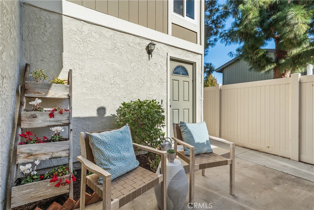 1041 Tustin Pines Way Tustin, CA 92780 - Photo 4 of 32 a view of a patio with table and chairs and potted plants
