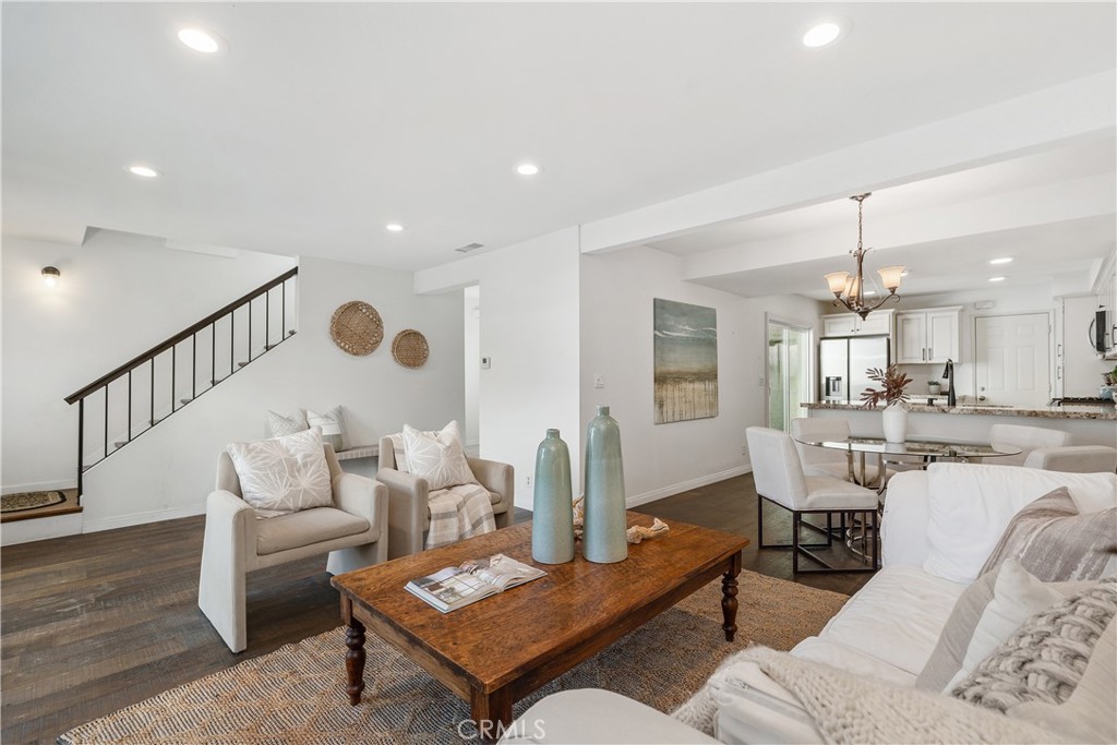 1041 Tustin Pines Way Tustin, CA 92780 - Photo 9 of 32 a living room with furniture and a dining table