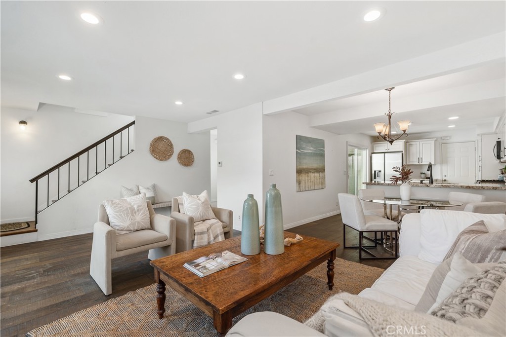 1041 Tustin Pines Way Tustin, CA 92780 - Photo 9 of 32 a living room with furniture and a dining table