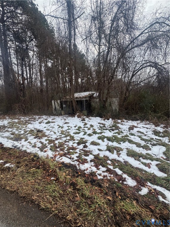 View of yard layered in snow