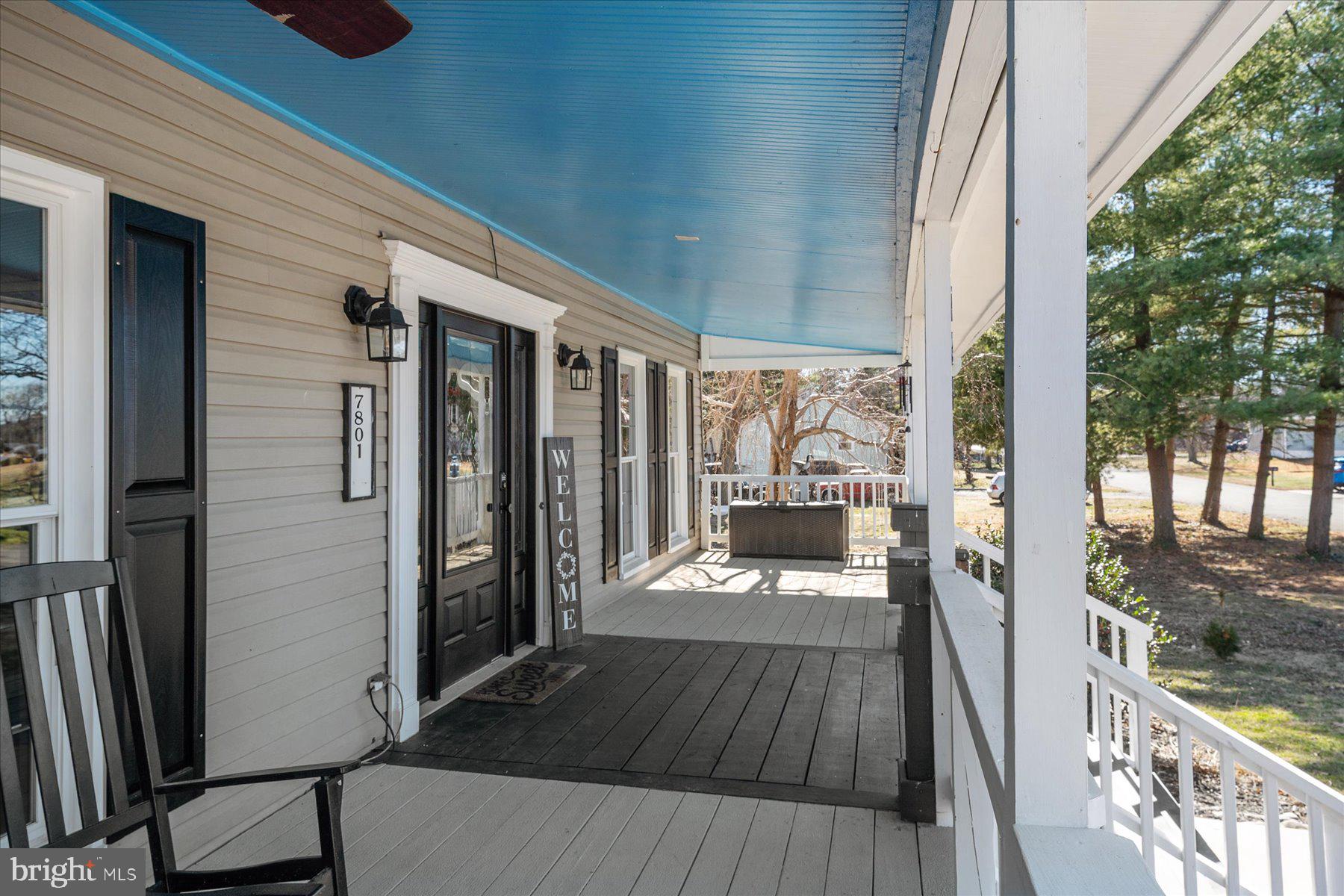 7801 Harle Road Pasadena, MD 21122 - Photo 14 of 64 a view of a balcony with wooden floor
