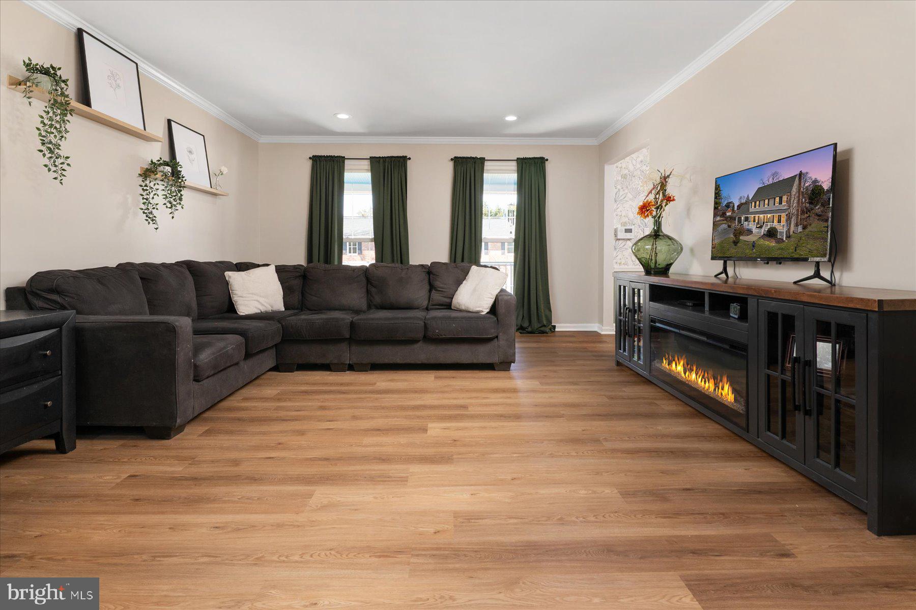 7801 Harle Road Pasadena, MD 21122 - Photo 21 of 64 a living room with furniture and a flat screen tv