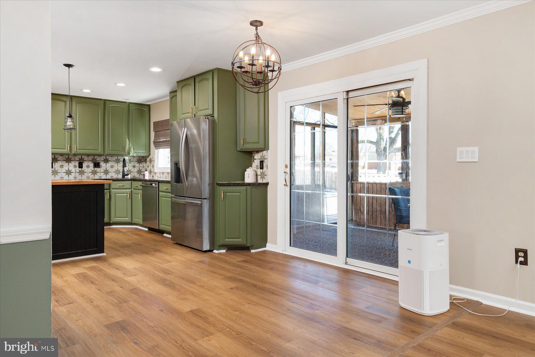 7801 Harle Road Pasadena, MD 21122 - Photo 24 of 64 a kitchen with stainless steel appliances granite countertop a refrigerator and a sink