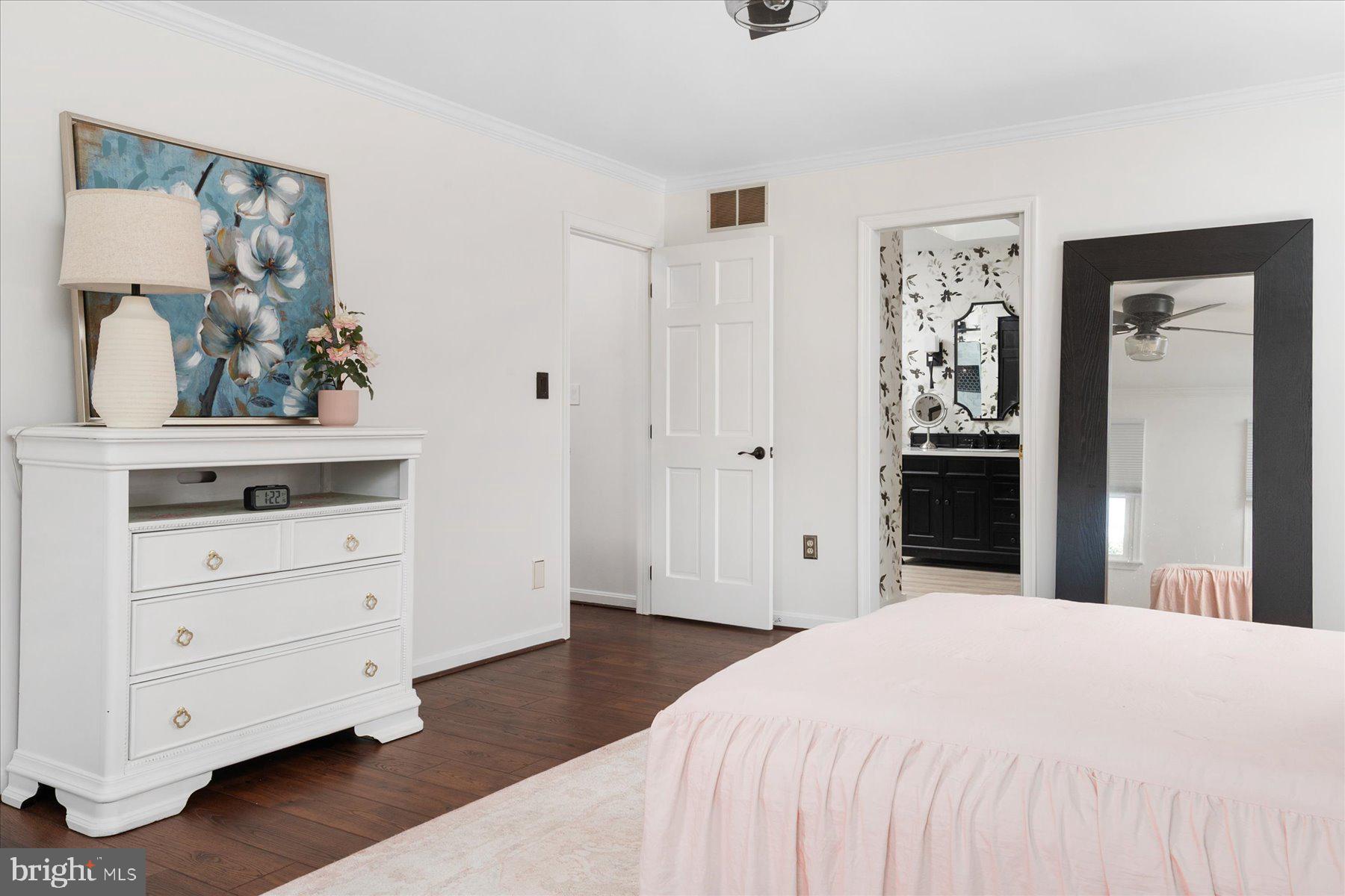 7801 Harle Road Pasadena, MD 21122 - Photo 34 of 64 a bedroom with a bed and painting on the wall