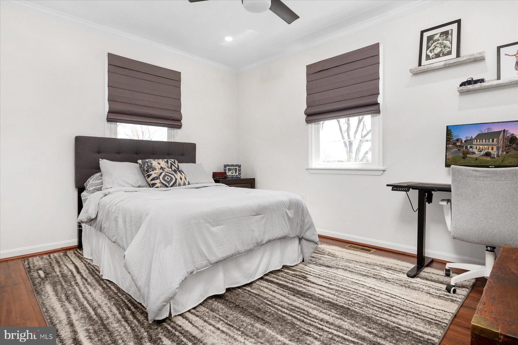 7801 Harle Road Pasadena, MD 21122 - Photo 40 of 64 a bedroom with a bed and window