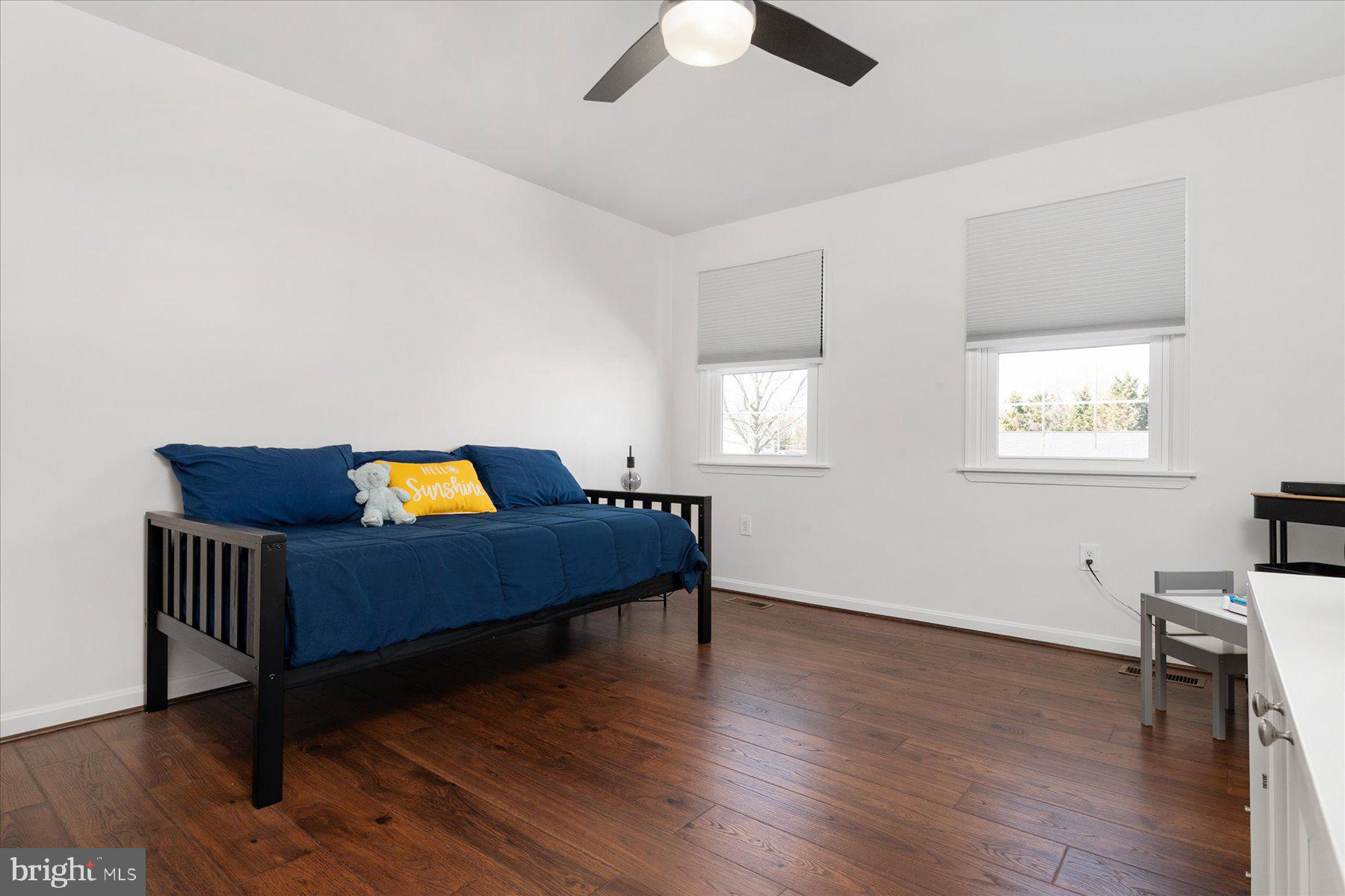 7801 Harle Road Pasadena, MD 21122 - Photo 42 of 64 a living room with furniture and a wooden floor