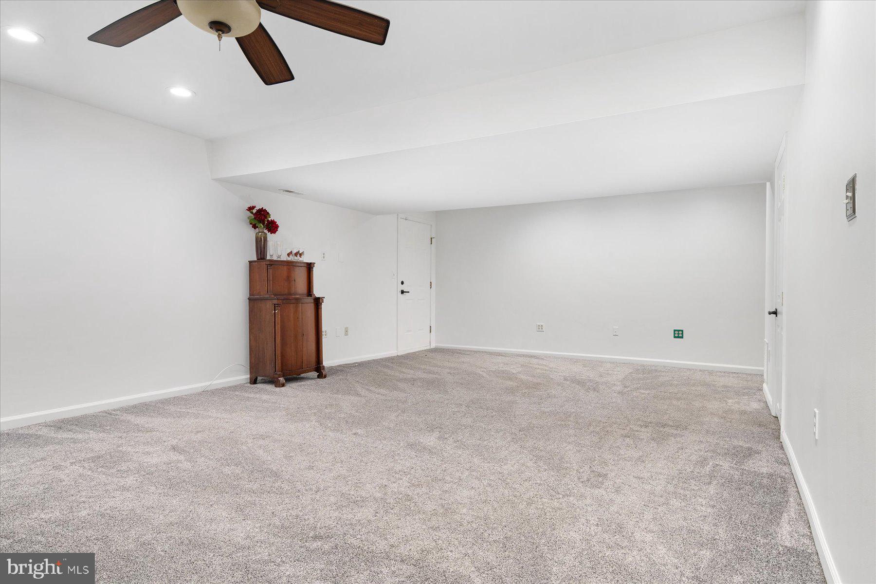 7801 Harle Road Pasadena, MD 21122 - Photo 44 of 64 an empty room with ceiling fan and window