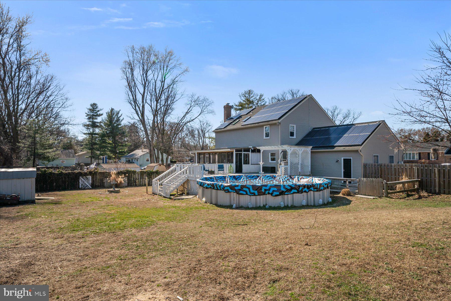 7801 Harle Road Pasadena, MD 21122 - Photo 50 of 64 a front view of a house with sitting area