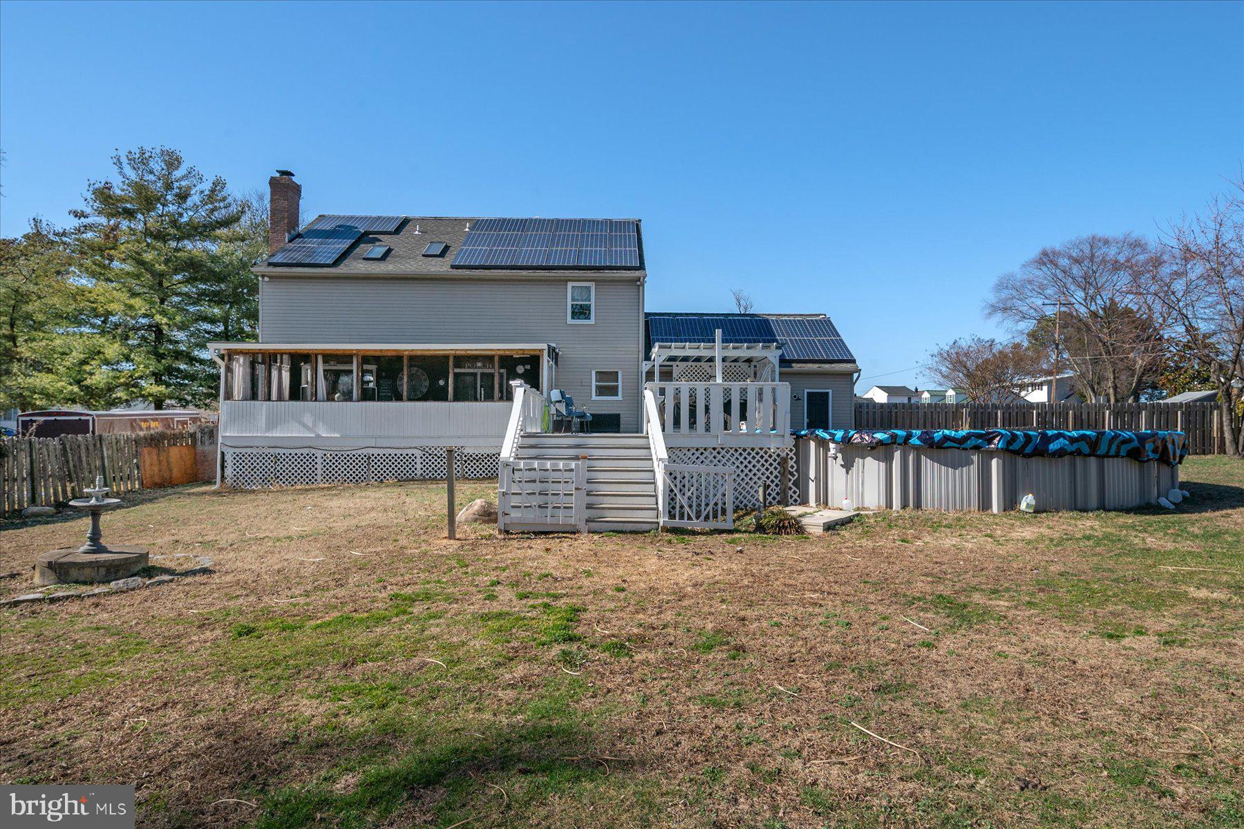 7801 Harle Road Pasadena, MD 21122 - Photo 51 of 64 a view of a house with a yard