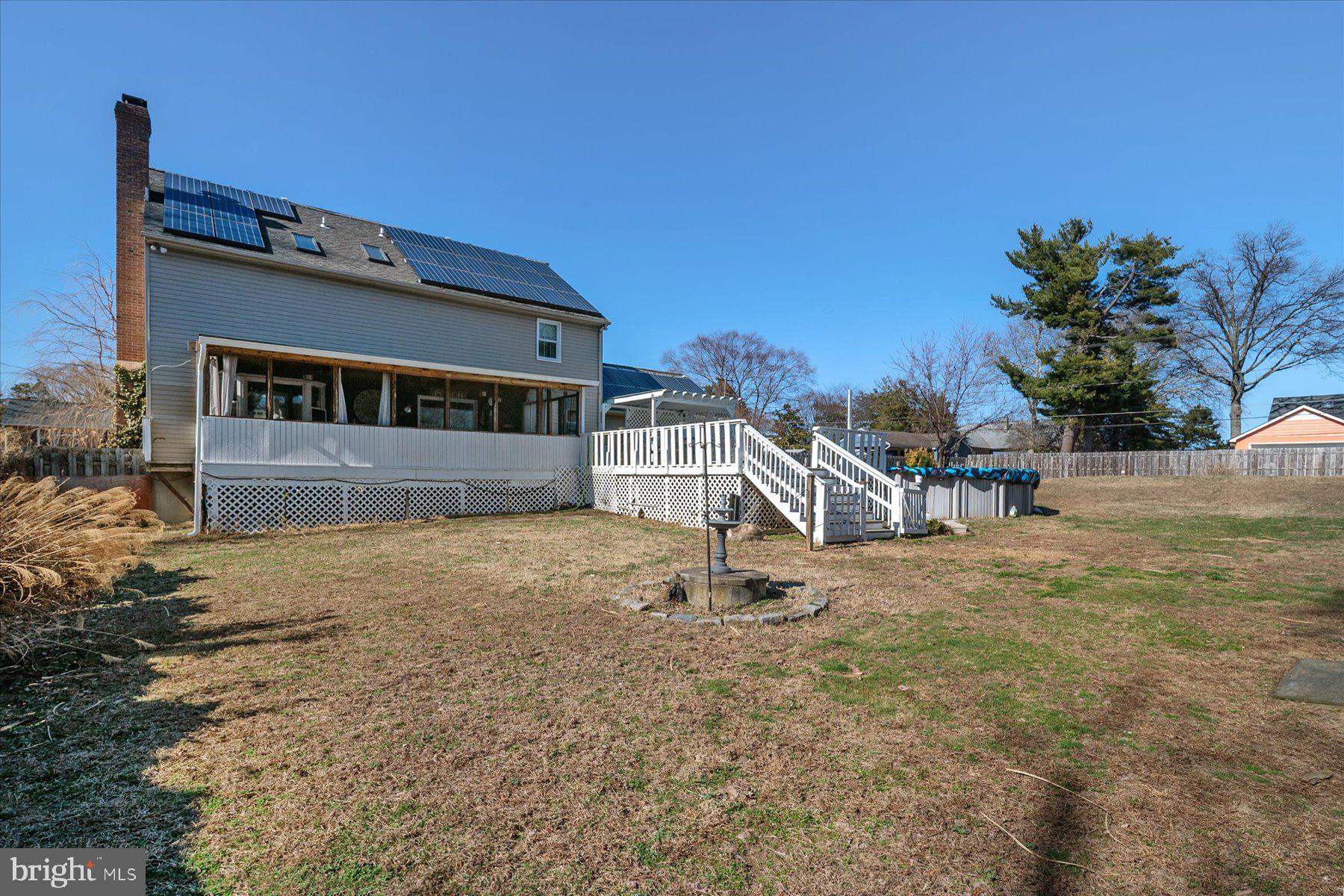 7801 Harle Road Pasadena, MD 21122 - Photo 54 of 64 a front view of a house with a yard