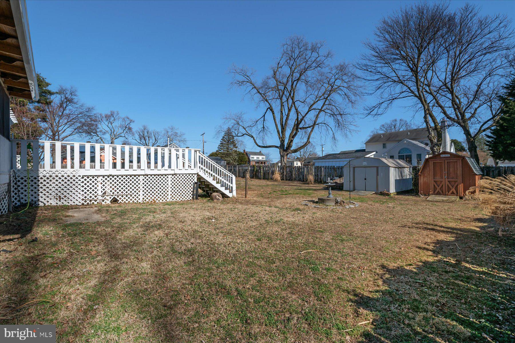7801 Harle Road Pasadena, MD 21122 - Photo 55 of 64 a view of a house with a yard