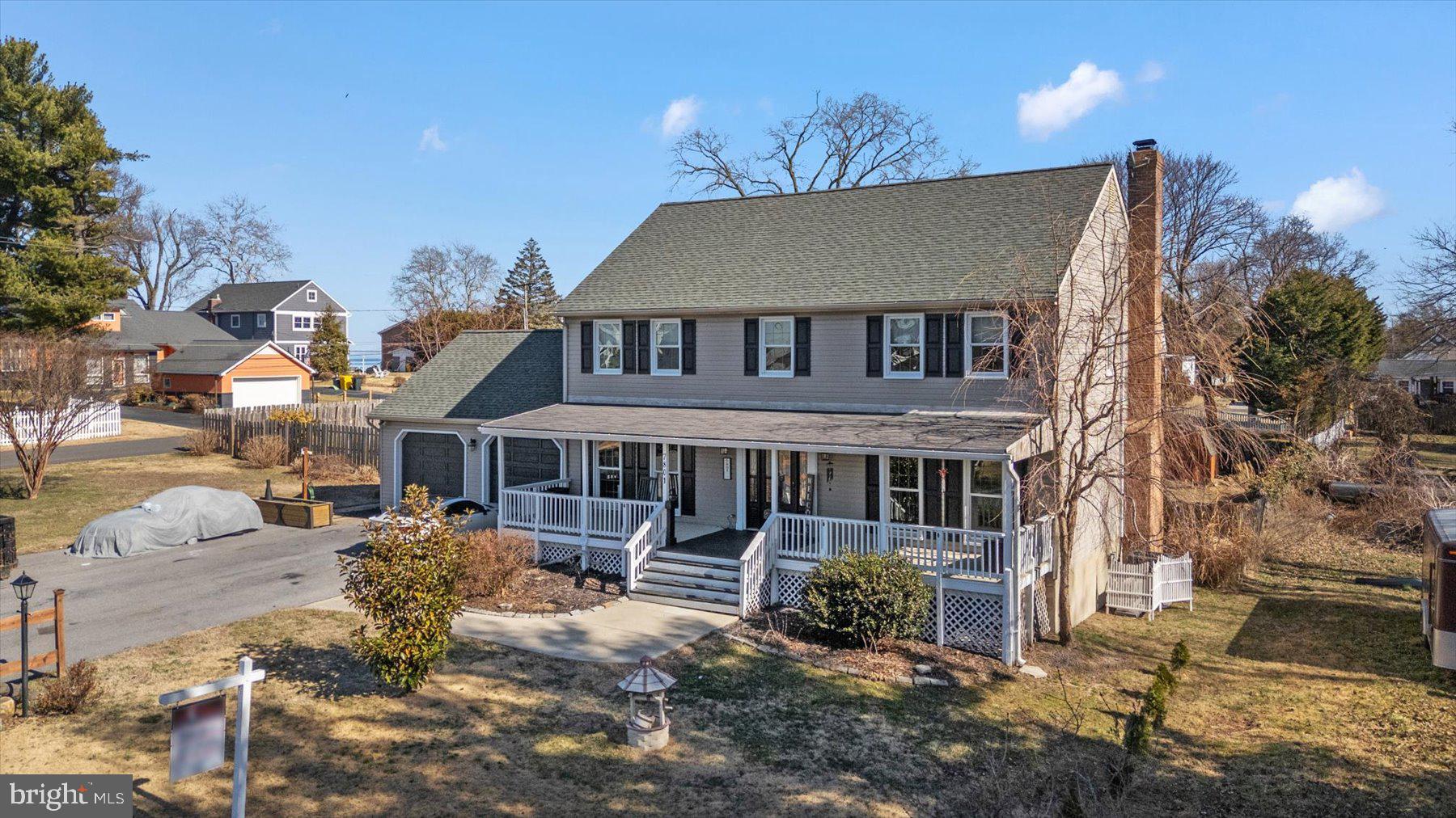 7801 Harle Road Pasadena, MD 21122 - Photo 56 of 64 front view of a house with a yard