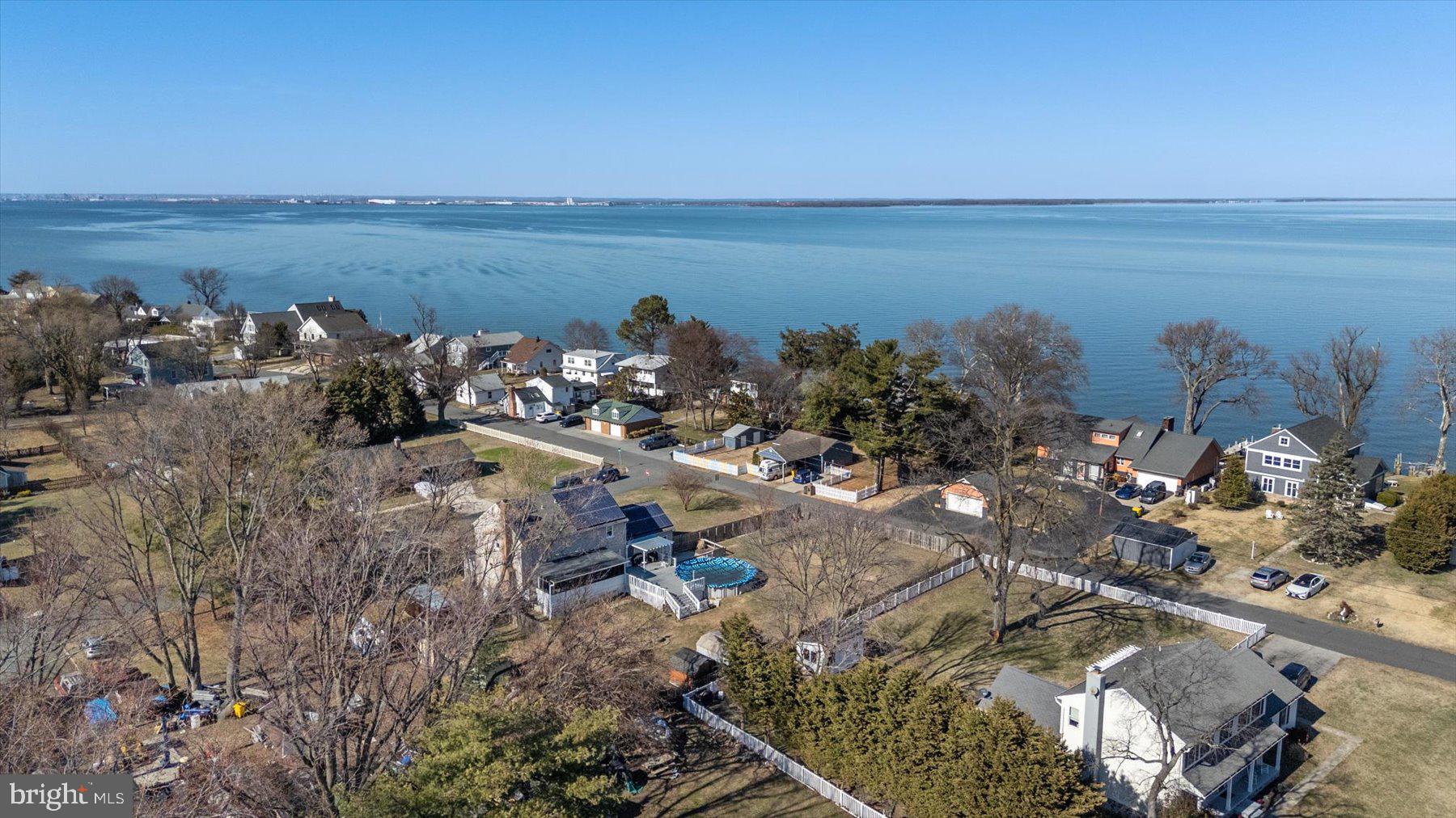 7801 Harle Road Pasadena, MD 21122 - Photo 8 of 64 a view of a lake with lawn chairs