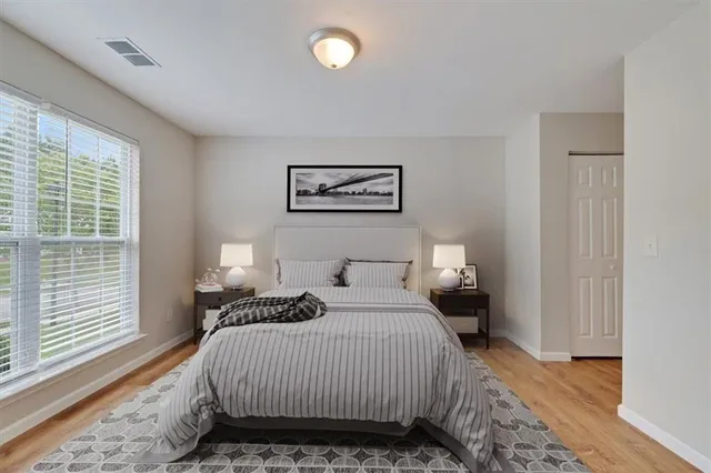 a white bath tub sitting in a bathroom next to a window
