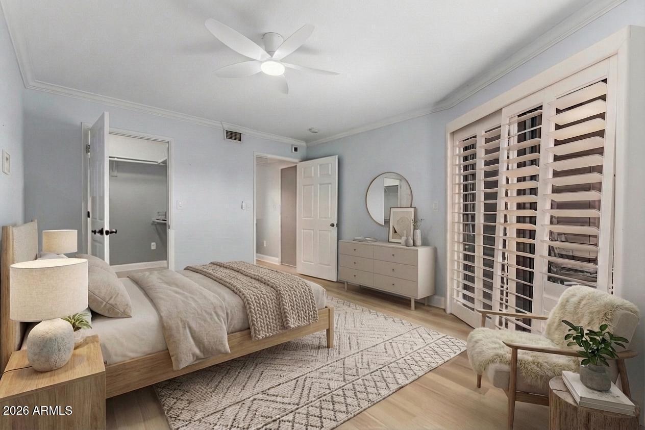 4303 East Cactus Road, Unit 126 Phoenix, AZ 85032 - Photo 19 of 31 a bedroom with bed and a window