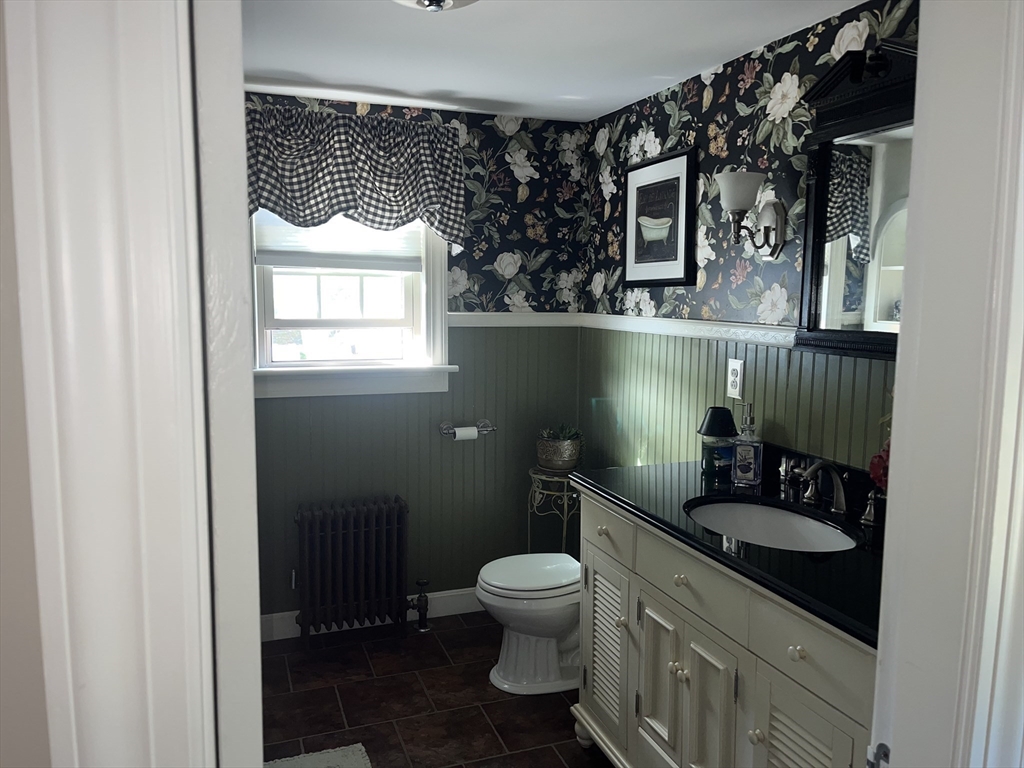 112 Chestnut Street Southbridge, MA 01550 - Photo 20 of 32 a bathroom with a sink toilet and a mirror