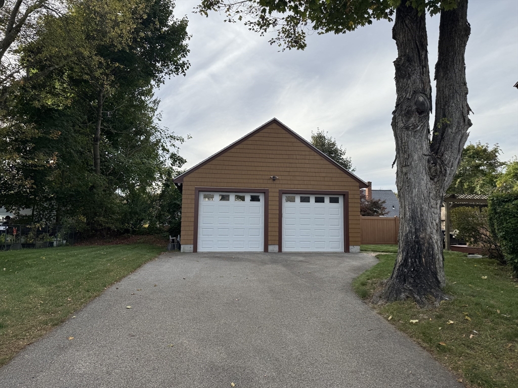 112 Chestnut Street Southbridge, MA 01550 - Photo 30 of 32 a front view of a house with a yard and large tree