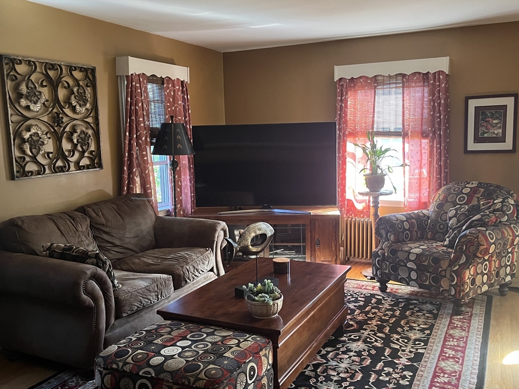 112 Chestnut Street Southbridge, MA 01550 - Photo 4 of 32 a living room with furniture and a flat screen tv