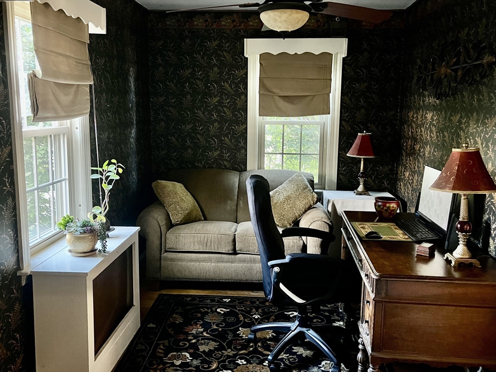 112 Chestnut Street Southbridge, MA 01550 - Photo 6 of 32 a living room with furniture and a fireplace