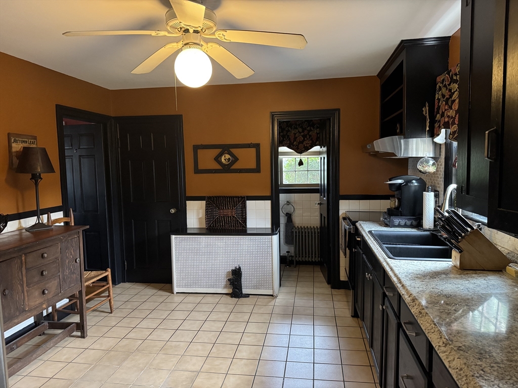 112 Chestnut Street Southbridge, MA 01550 - Photo 7 of 32 a kitchen with stainless steel appliances granite countertop a sink stove and refrigerator