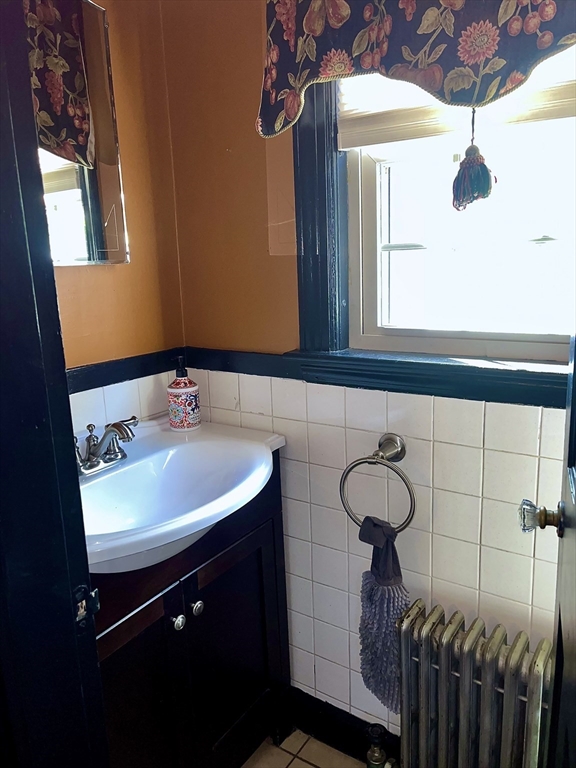 112 Chestnut Street Southbridge, MA 01550 - Photo 9 of 32 a bathroom with a sink and a mirror
