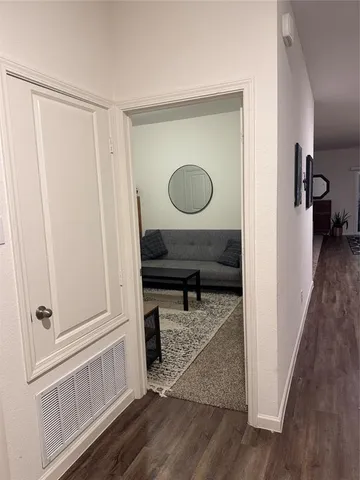 a view of a backyard with seating area and hardwood floor