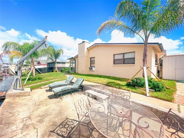 a view of a backyard with a garden and plants