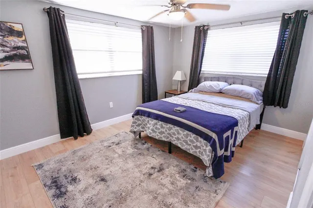 a bedroom with a bed and window