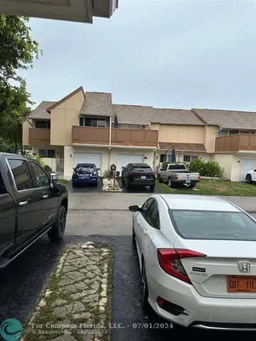 a swimming pool view with a seating space