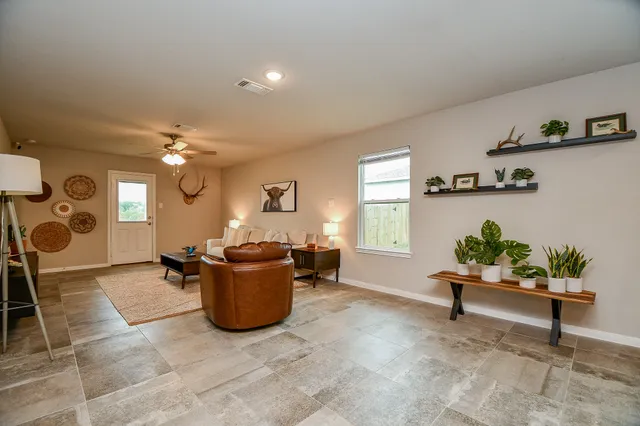 a living room with furniture and a window