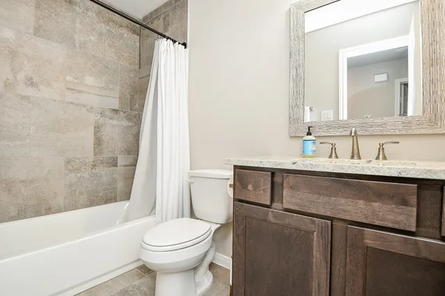 a bathroom with a sink a toilet and a bathtub