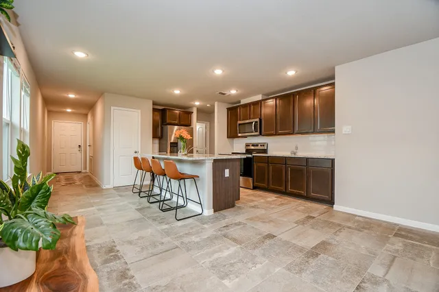 a kitchen with a refrigerator and a microwave