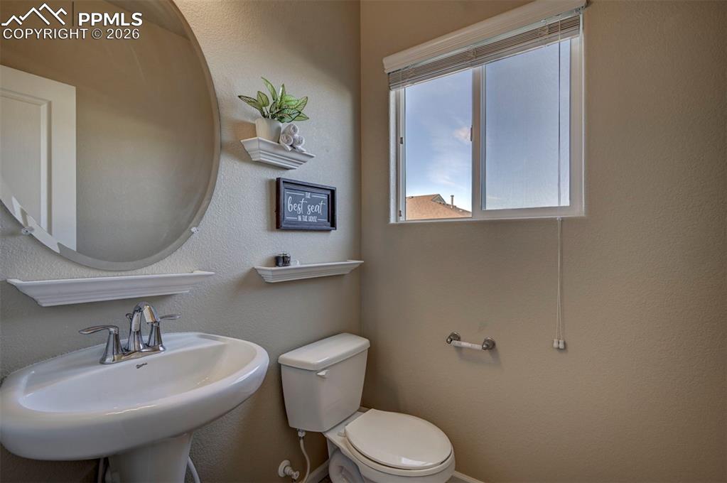 5653 Saint Patrick View Colorado Springs, CO 80923 - Photo 22 of 43 Half bath with neutral colors and great light.
