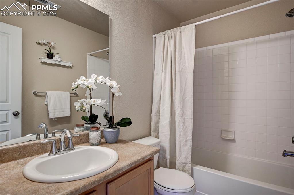 5653 Saint Patrick View Colorado Springs, CO 80923 - Photo 28 of 43 Full bathroom next to the secondary bedroom and laundry area.