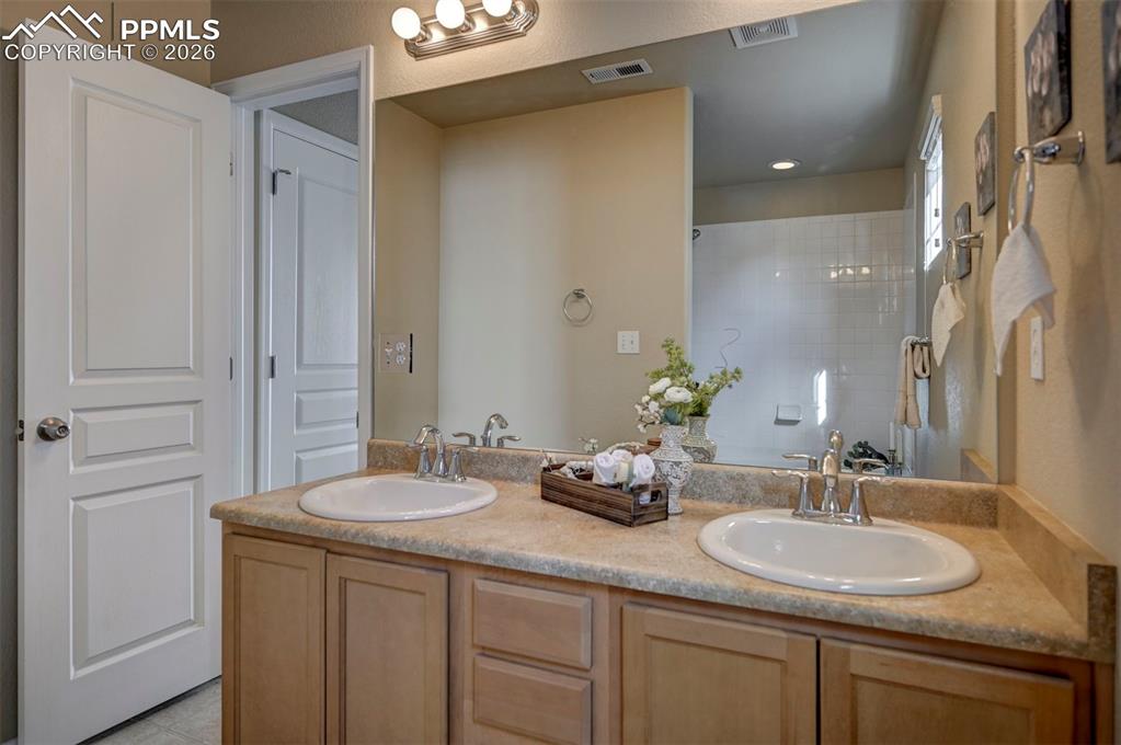 5653 Saint Patrick View Colorado Springs, CO 80923 - Photo 35 of 43 Two sinks, lots of space in primary bathroom.