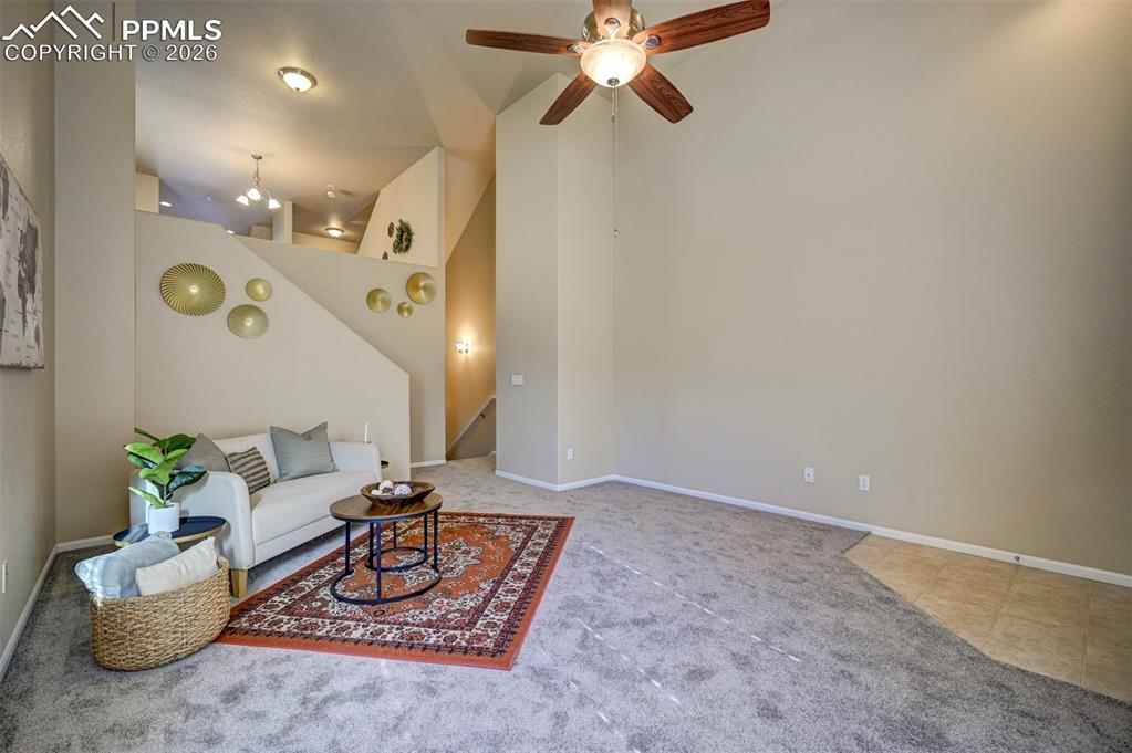 5653 Saint Patrick View Colorado Springs, CO 80923 - Photo 8 of 43 From living room you can go up to the kitchen/dining area or down to the garage.