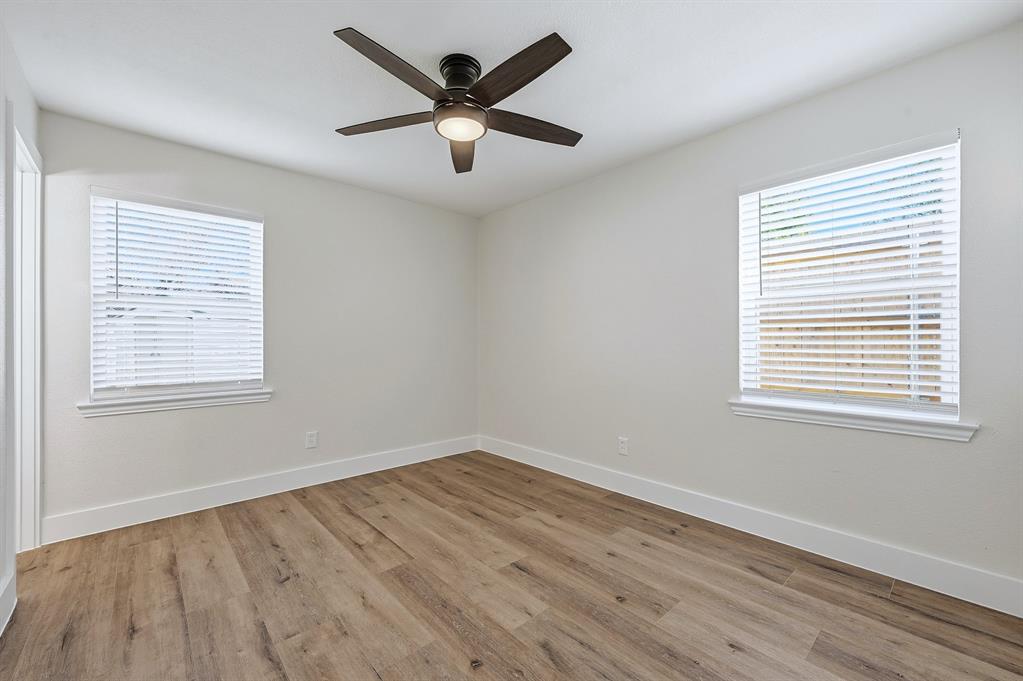1016 Calcutta Street Hurst, TX 76053 - Photo 22 of 34 a view of a big room with wooden floor and windows