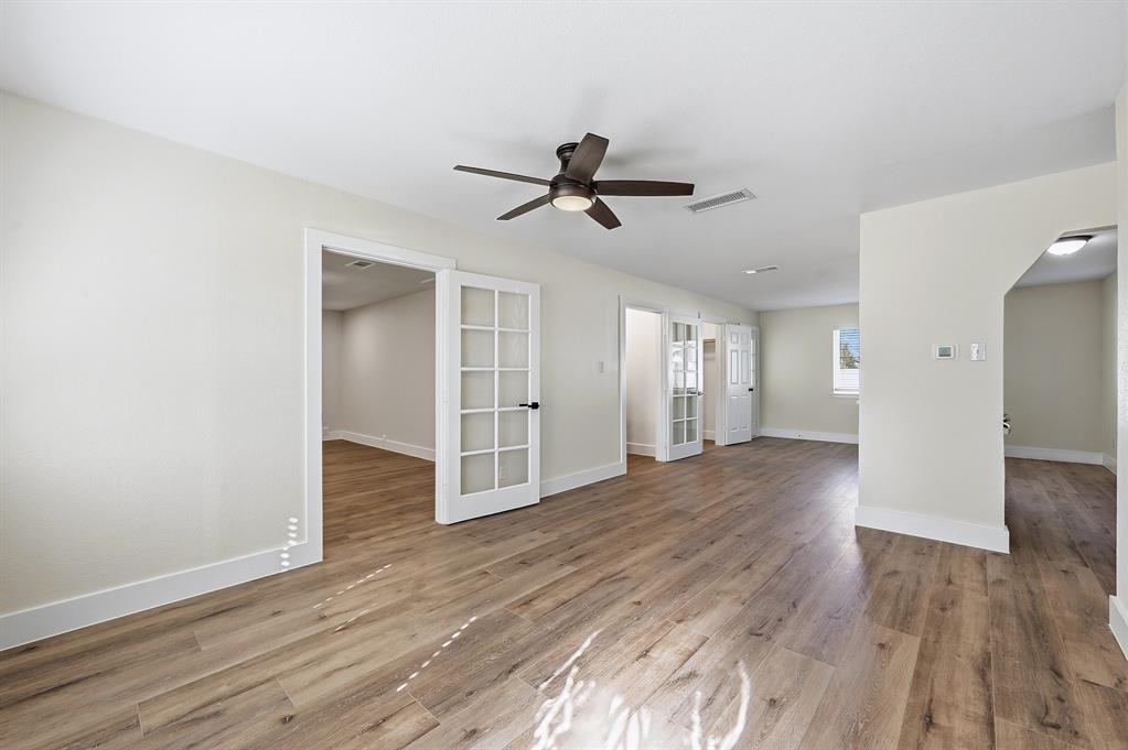 1016 Calcutta Street Hurst, TX 76053 - Photo 28 of 34 a view of a room with wooden floor and ceiling fan