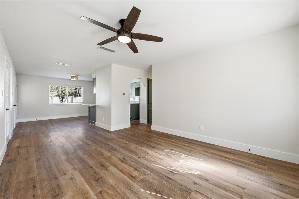 1016 Calcutta Street Hurst, TX 76053 - Photo 29 of 34 wooden floor in an empty room with a window
