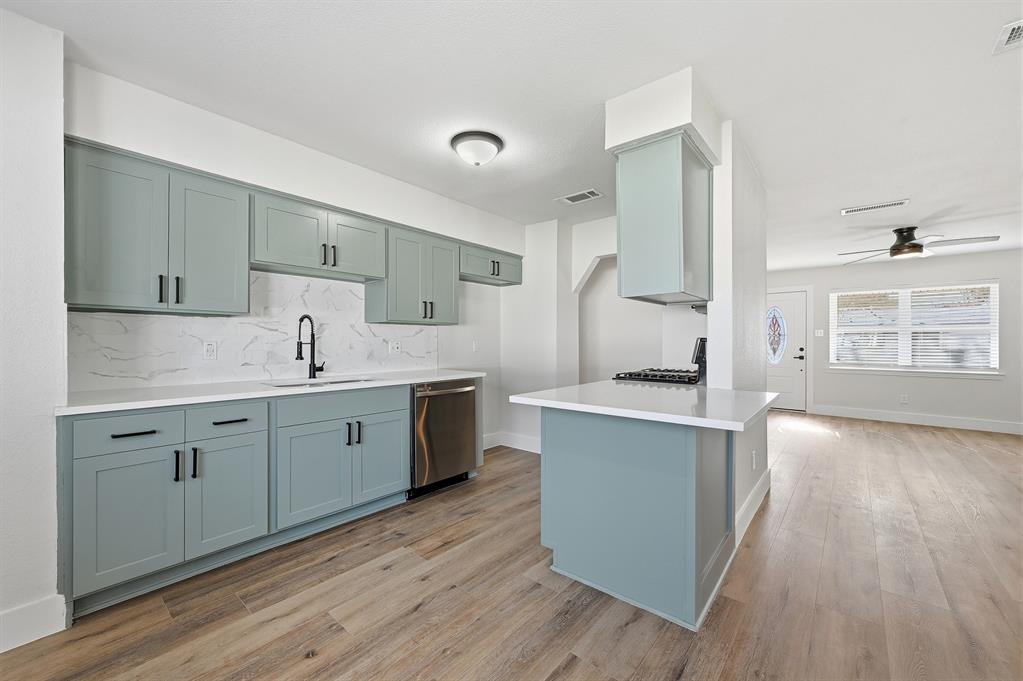 1016 Calcutta Street Hurst, TX 76053 - Photo 10 of 34 a kitchen with a sink stove and cabinets