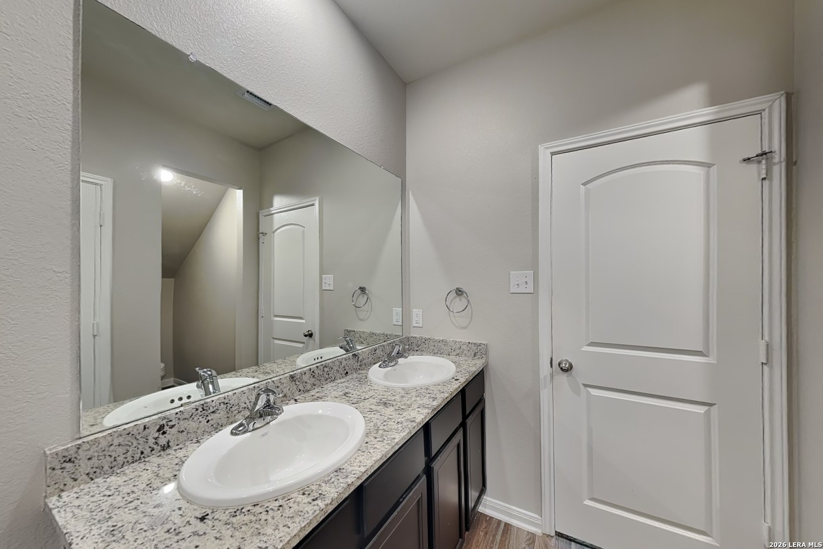 3022 Citron Garden Converse, TX 78109 - Photo 8 of 21 a bathroom with a granite countertop sink and a mirror
