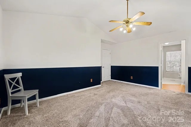 a living room with a table and chairs