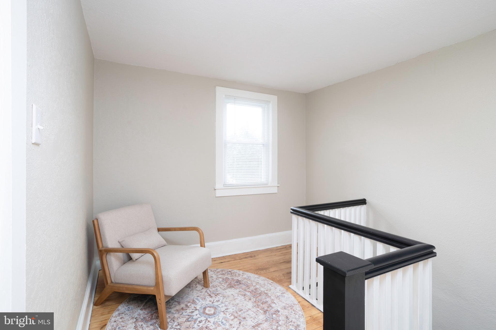 529 North 6th Street Denton, MD 21629 - Photo 15 of 21 a hallway with a couch and a window
