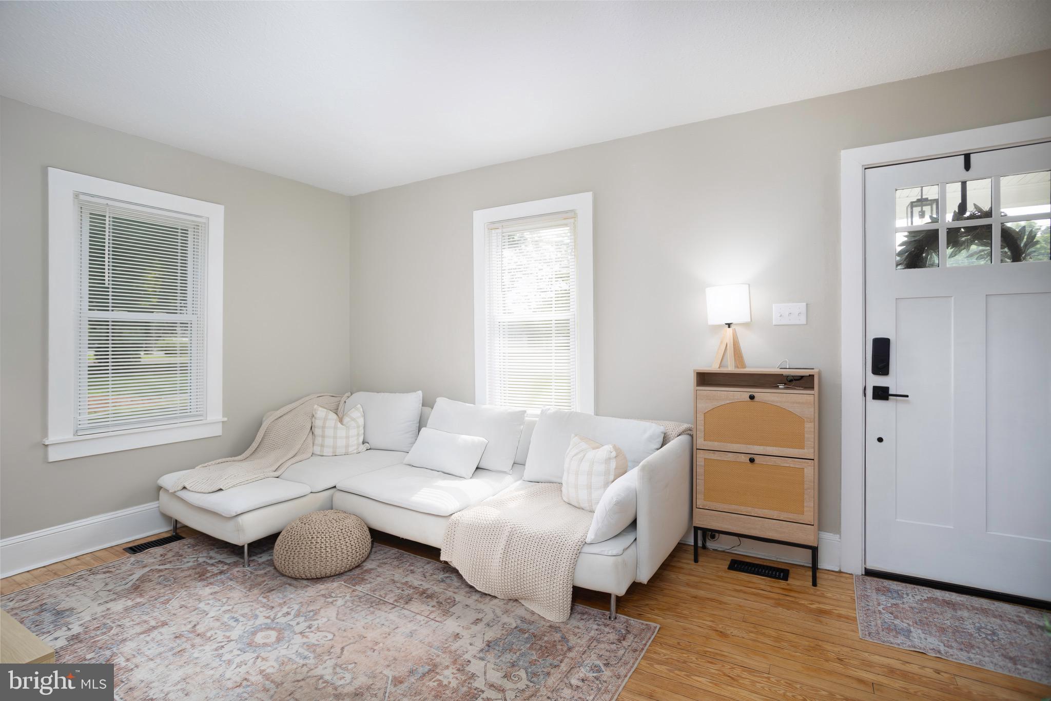 529 North 6th Street Denton, MD 21629 - Photo 4 of 21 a living room with furniture and wooden floor