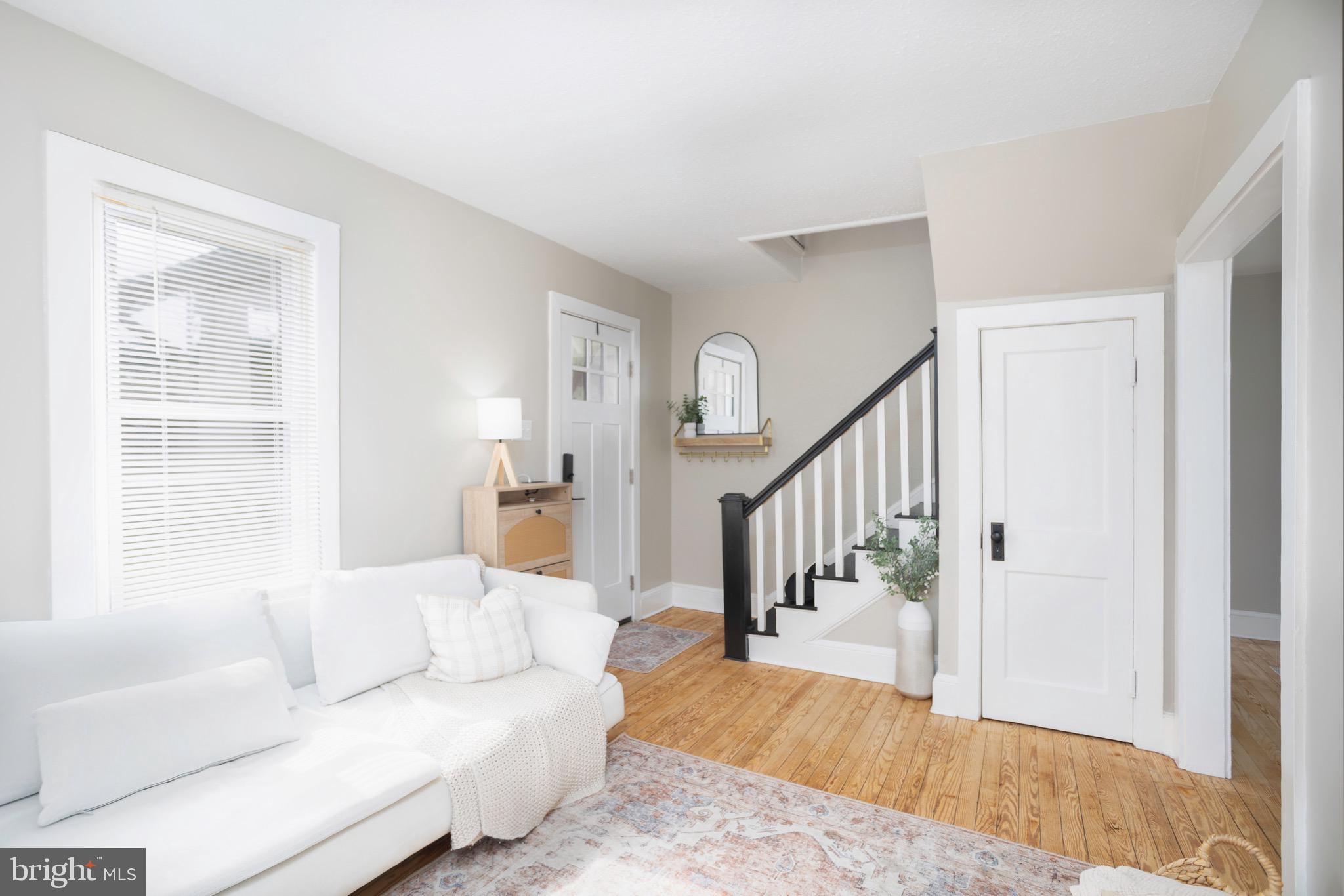 529 North 6th Street Denton, MD 21629 - Photo 5 of 21 a living room with furniture and stairs